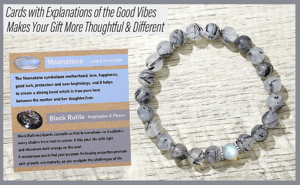 Black Rutilated Quartz and Moonstone crystal beaded bracelet with a gift explanation card on a wooden background.