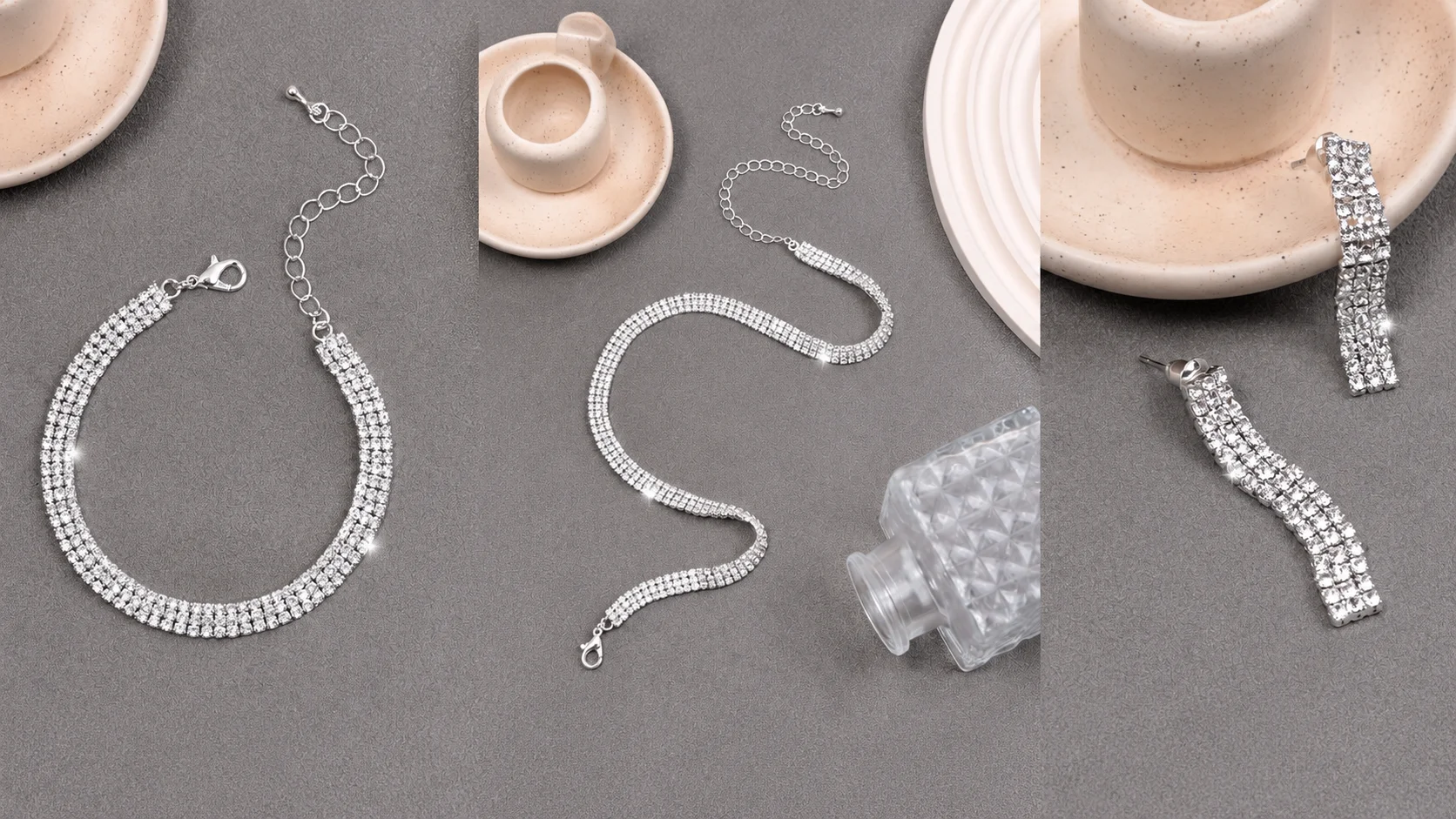 Sparkling silver three-row rhinestone bracelet, matching multi-layer necklace, and long drop fringe earrings on a grey background.